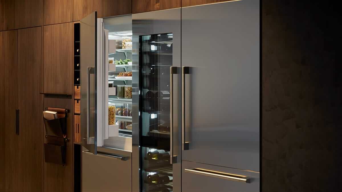 Kitchen interior showing a stainless steel refrigerator column paired with other professional appliances