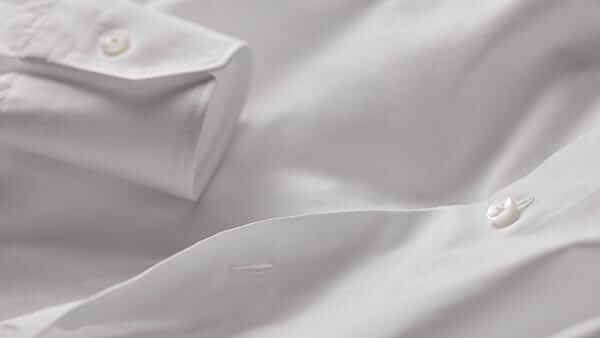 Close-up of light blue dress shirt fabric